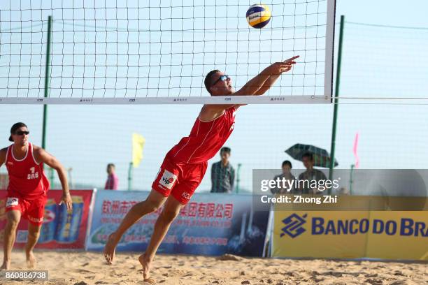 Djordje Klasnic of Serbia in action with Lazar Kolaric of Serbia during the match against Cesar Do Nascimento Junior Julio and Ahmed Tijan of Qatar...