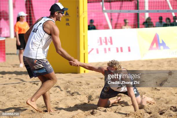 Cole Durant and Zachery Schubert of Australia celebrate during the match against Dries Koekelkoren and Tom van Walle of Belgium on Day 3 of 2017 FIVB...