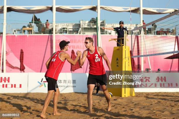 Nils Ehlers and Lorenz Schumann of Germany celebrate during the match against Tom van Steenis and Ruben Penninga of Netherlands on Day 3 of 2017 FIVB...