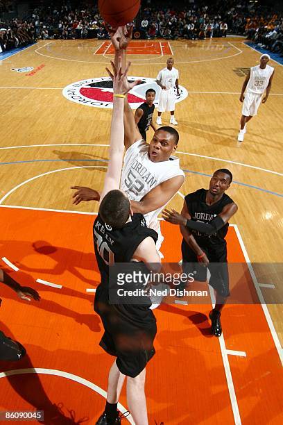 Daniel Orton of the White team shoots against Ryan Kelly of the Black team during the 2009 Jordan Brand All-American Classic at Madison Square Garden...