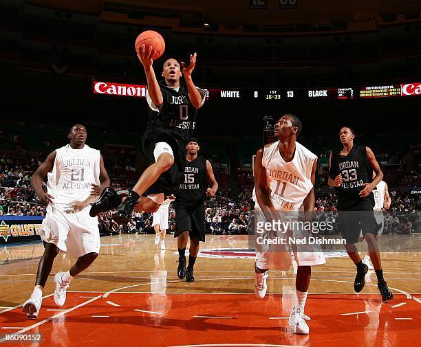Avery Bradley of the Black team shoots against John Wall of the White team during the 2009 Jordan Brand All-American Classic at Madison Square Garden...
