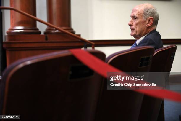 Director of National Intelligence Dan Coats listens to National Security Agency Director Michael Rogers argue for the renewal of Section 702 of the...