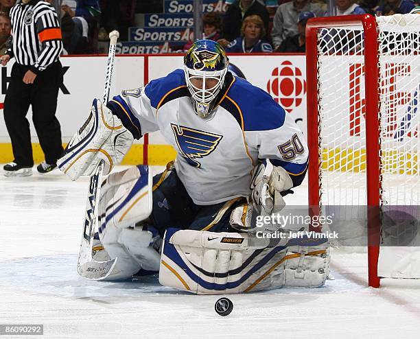 Chris Mason of the St. Louis Blues makes a save during Game Two of the Western Conference Quarterfinal Round of the 2009 Stanley Cup Playoffs against...