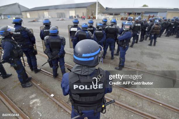 French police face dockers demonstrating against the labour law reform and the ecologic transition on the sidelines of the inauguration of the first...