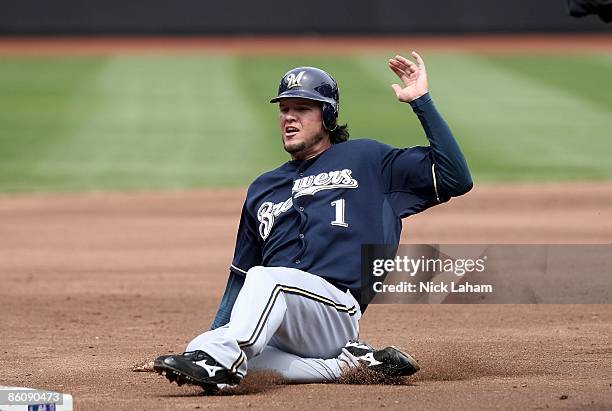 Corey Hart of the Milwaukee Brewers slides into third against the New York Mets at Citi Field on April 19, 2009 in the Flushing neighborhood of the...