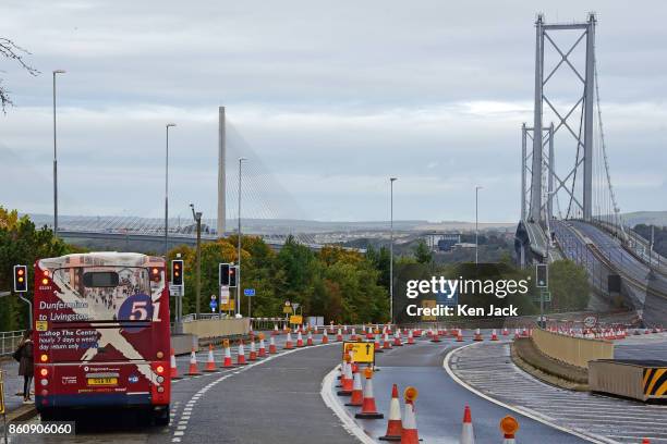 Passenger boards a bus on the approach road to the old Forth Road Bridge as a phased re-opening to some scheduled bus services begins, on October 13,...