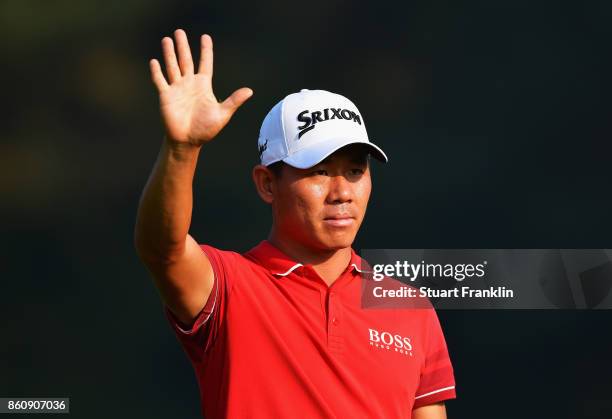 Ashun Wu of China waves during day two of the Italian Open at Golf Club Milano - Parco Reale di Monza on October 13, 2017 in Monza, Italy.