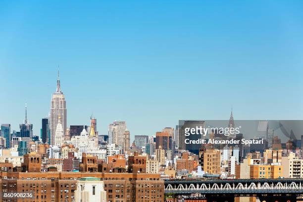manhattan skyline with empire state building and chrysler building, new york city, usa - lower manhattan stock pictures, royalty-free photos & images