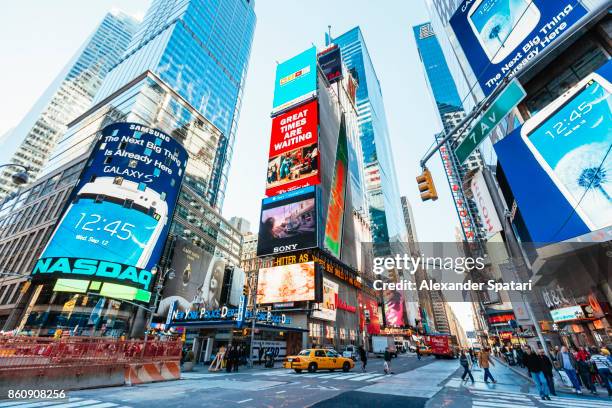 bright advertising screens on times square, manhattan, new york city, usa - international landmark foto e immagini stock