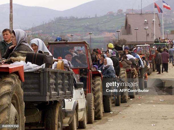 Ethnic Albanian refugees from Kosovo line up with their tractors to pass from Yugoslavia into Albania at the checkpoint of Morina, outside Kukes,...