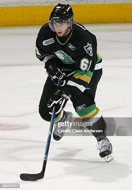 John Tavares of the London Knights skates with the puck in Game Four of the Western Conference Final against the Windsor Spitfires on April 20, 2009...