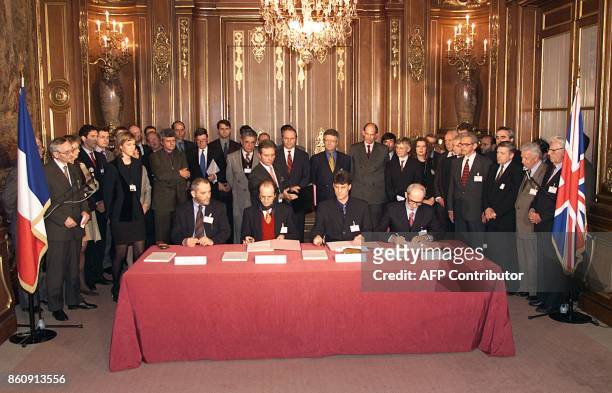 Ethnic Albanian negotiators at the Kosovo peace talks, Veton Surroi, Ibrahim Rugova, Hashim Thaci, Rexhep Qosja sign a draft accord, hammered out...