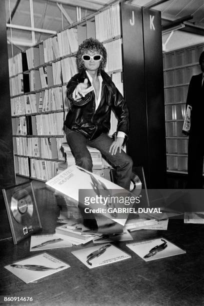 Photo taken on October 30, 1978 in Paris shows French singer Michel Polnareff as he just received a gold record for his record "Coucou me revoilou"...