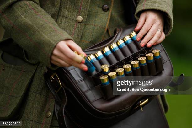Detail of a woman's cartridge bag during a clay pigeon shoot
