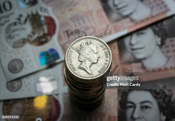 In this photo illustration a old £1 coin is seen on top of a stack of coins on October 13, 2017 in Bristol, England. The deadline to use the old one...