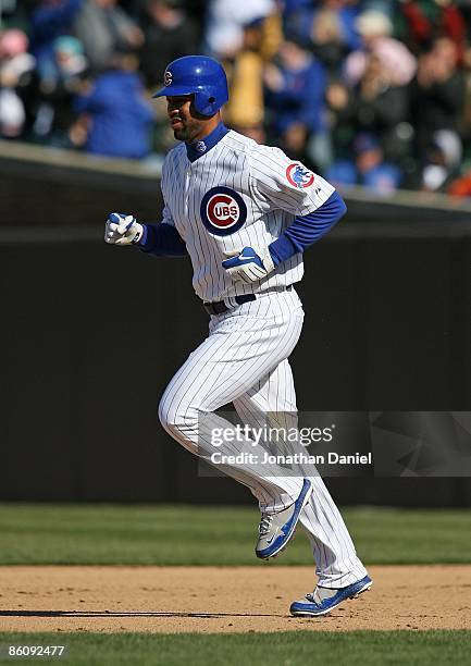 Derrek Lee of the Chicago Cubs runs the bases after hitting his first home run of the season in the 9th inning against the Colorado Rockies on April...