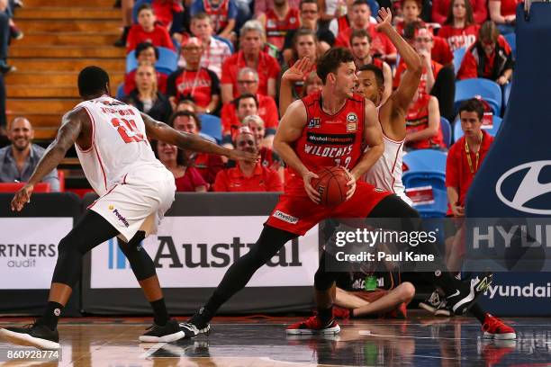 Angus Brandt of the Wildcats works to the basket during the round two NBL match between the Perth Wildcats and the Illawarra Hawks at Perth Arena on...