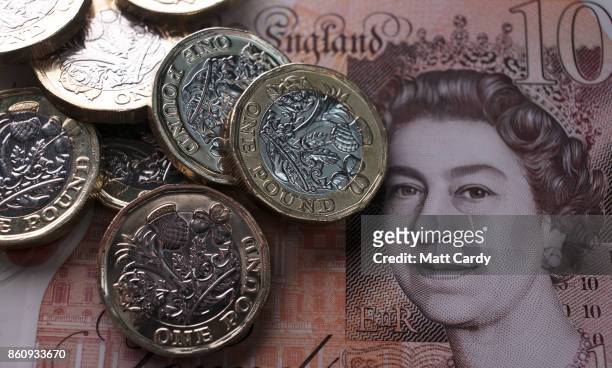 In this photo illustration, £1 coins are seen with the new £10 note on October 13, 2017 in Bath, England. Currency experts have warned that as the...