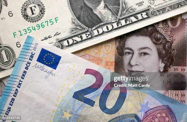 In this photo illustration, the new £10 note is seen alongside euro notes and US dollar bills on October 13, 2017 in Bath, England. Currency experts...