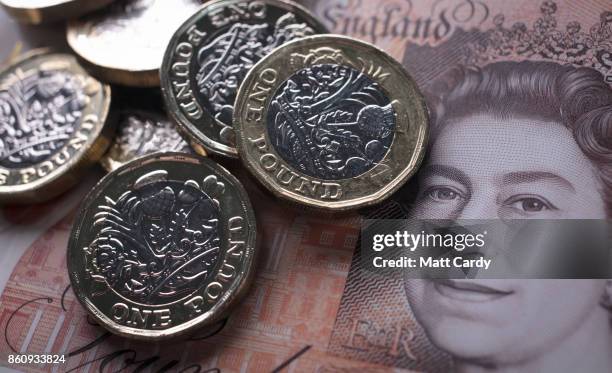 In this photo illustration, £1 coins are seen with the new £10 note on October 13, 2017 in Bath, England. Currency experts have warned that as the...