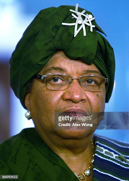 Liberian President Ellen Johnson Sirleaf listens during a joint press availability with U.S. Secretary of State Hillary Rodham Clinton at the...