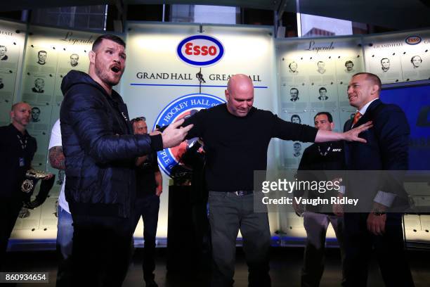 Michael Bisping and Georges St-Pierre face off following the UFC 217 press conference with Dana White at the Hockey Hall of Fame on October 13, 2017...