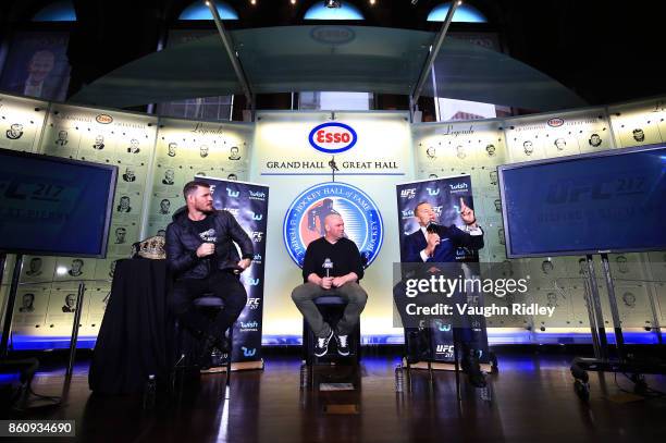 Georges St-Pierre speaks to the media during the UFC 217 press conference with Michael Bisping and Dana White at the Hockey Hall of Fame on October...