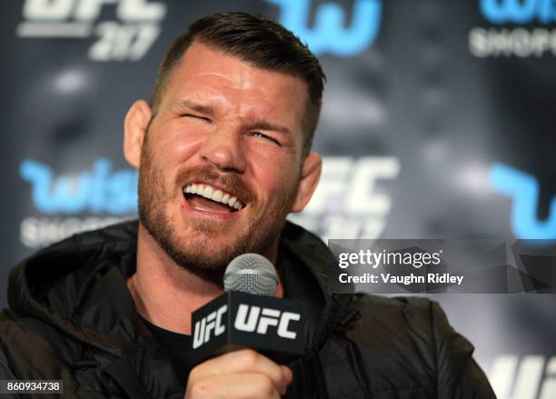 Michael Bisping speaks to the media during the UFC 217 press conference with Dana White and Georges St-Pierre at the Hockey Hall of Fame on October...