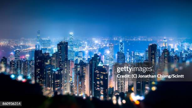 city in a crater - hong kong skyline stock pictures, royalty-free photos & images