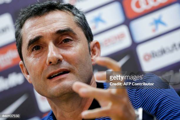 Barcelona's Spanish coach Ernesto Valverde gestures during a press conference at the FC Barcelona's Joan Gamper sports center in Sant Joan Despi,...