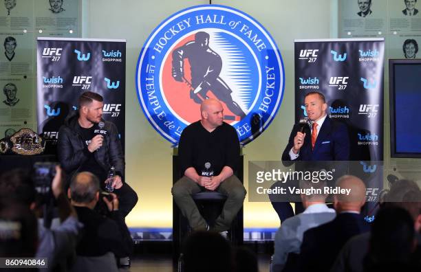 Georges St-Pierre speaks to the media during the UFC 217 press conference with Michael Bisping and Dana White at the Hockey Hall of Fame on October...