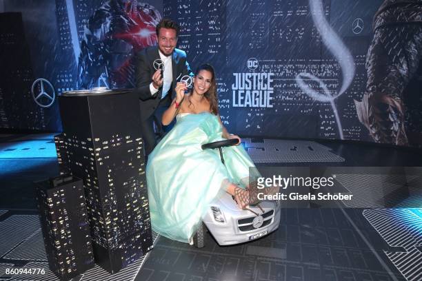 Bachelor Sebastian Pannek and his girlfriend Clea-Lacy Juhn drives a bobby car during the 'Tribute To Bambi' gala at Station on October 5, 2017 in...