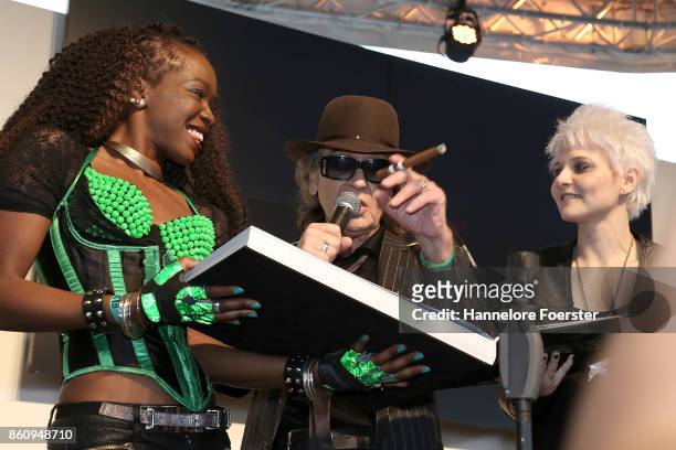 Singer Udo Lindenberg pose with photographer Tine Acke for a photo during the presentation of a book about his life at the 2017 Frankfurt Book Fair...