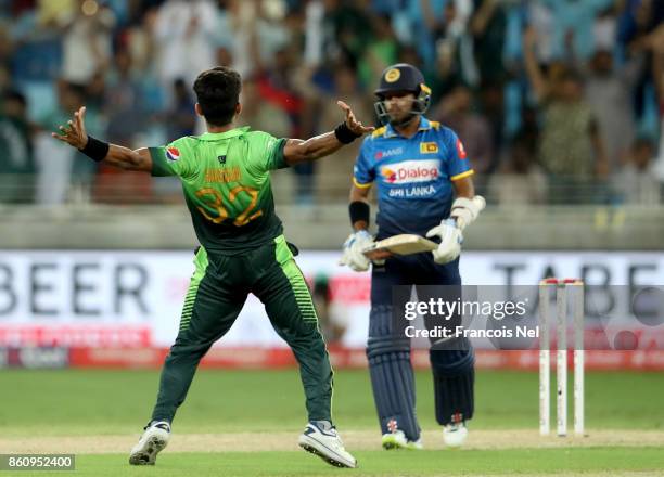 Hasan Ali of Pakistan celebrate after dismissing Kusal Mendis of Sri Lanka during the first One Day International match between Pakistan and Sri...