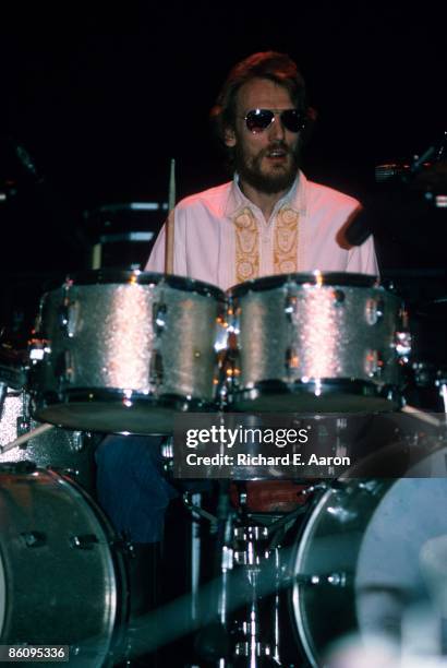 Photo of Ginger BAKER; Drummer Ginger Baker performing on stage, sunglasses