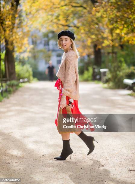 Sonia Lyson wearing brown Loeffler Randall teddy fake fur bag, red ruffled skirt Gannix x Anita Hass, oversized cashmere sweater Zara, black sock...