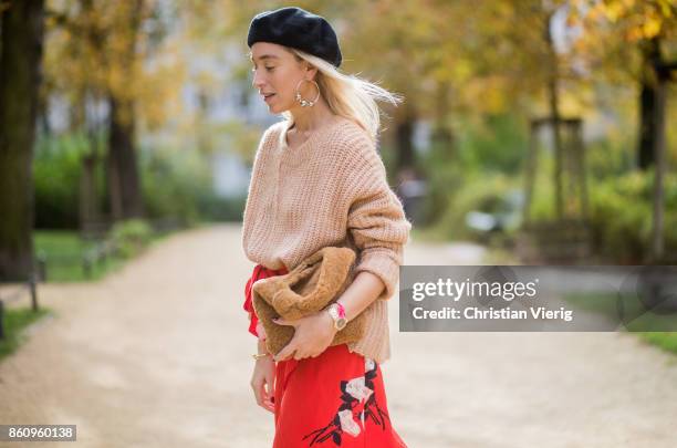 Sonia Lyson wearing brown Loeffler Randall teddy fake fur bag, red ruffled skirt Gannix x Anita Hass, oversized cashmere sweater Zara, black sock...