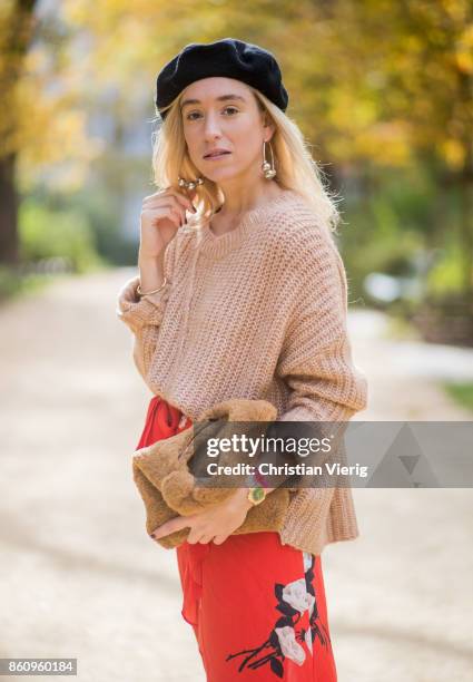 Sonia Lyson wearing brown Loeffler Randall teddy fake fur bag, red ruffled skirt Gannix x Anita Hass, oversized cashmere sweater Zara, black sock...