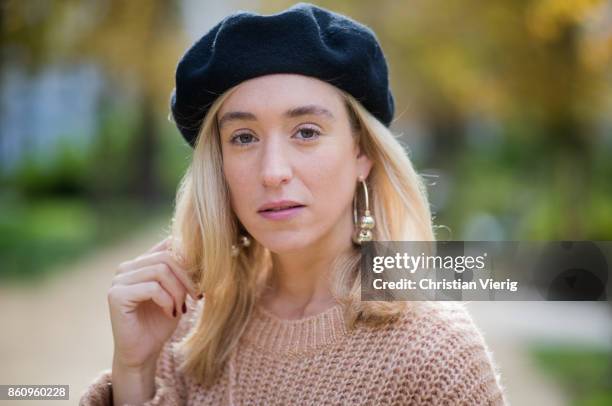 Sonia Lyson wearing brown Loeffler Randall teddy fake fur bag, red ruffled skirt Gannix x Anita Hass, oversized cashmere sweater Zara, black sock...