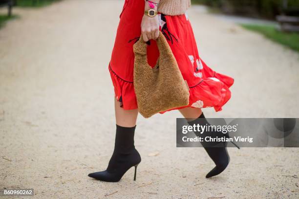 Sonia Lyson wearing brown Loeffler Randall teddy fake fur bag, red ruffled skirt Gannix x Anita Hass, oversized cashmere sweater Zara, black sock...