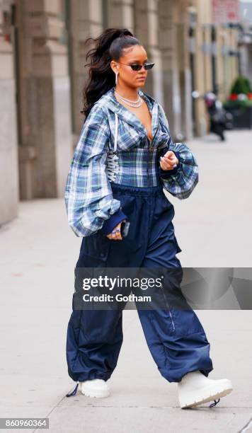 Rihanna departs her apartment on October 13, 2017 in New York City.