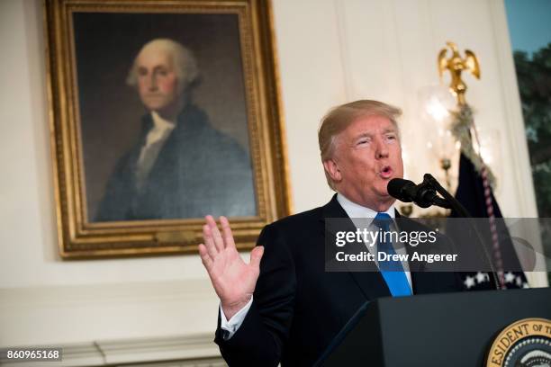 President Donald Trump makes a statement on the administration's strategy for dealing with Iran, in the Diplomatic Reception Room in the White House,...