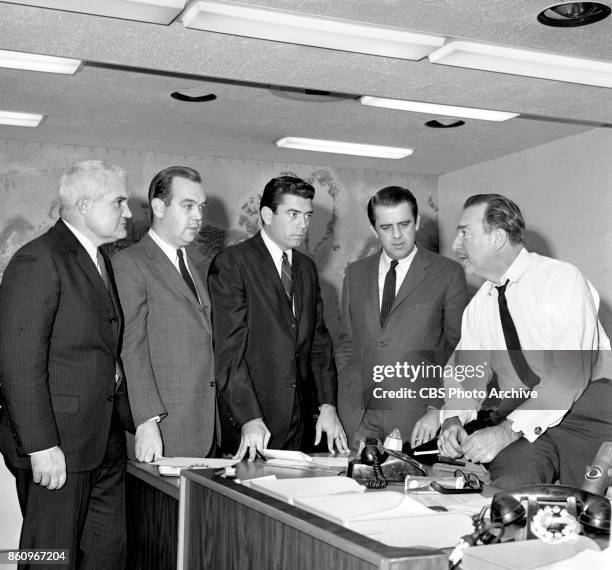 Newsmen gather for a group photo. Bill Leonard, Charles Kuralt, Dan Rather, Hughes Rudd and Walter Cronkite. December 31, 1963. New York, NY.