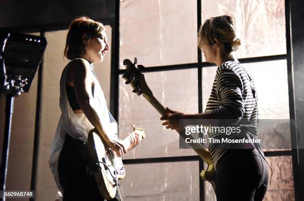 Emily Kokal and Jenny Lee Lindberg of Warpaint perform during the "Global Spirit Tour" at ORACLE Arena on October 10, 2017 in Oakland, California.