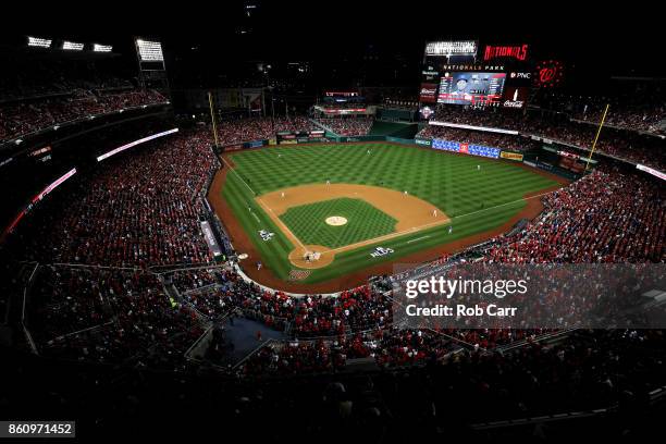 The Chicago Cubs bat against the Washington Nationals in the first inning of game five of the National League Division Series at Nationals Park at...