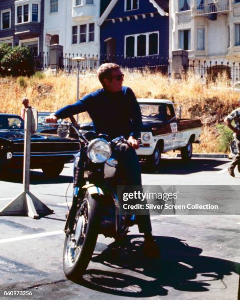 American actor Steve McQueen sits on a motorcycle on the set of 'Bullitt' , California, 1968.