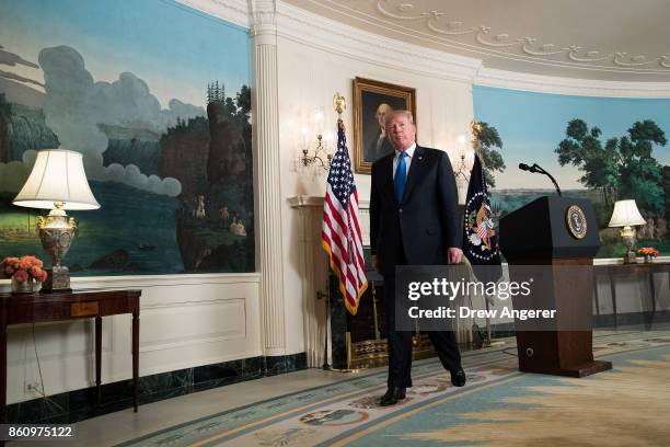 President Donald Trump leaves the podium after making a statement on the administration's strategy for dealing with Iran, in the Diplomatic Reception...