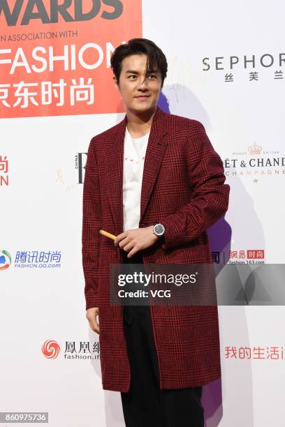 Singer Kenji Wu arrives at red carpet for the ELLE Style Awards at Shanghai Exhibition Center on October 13, 2017 in Shanghai, China.