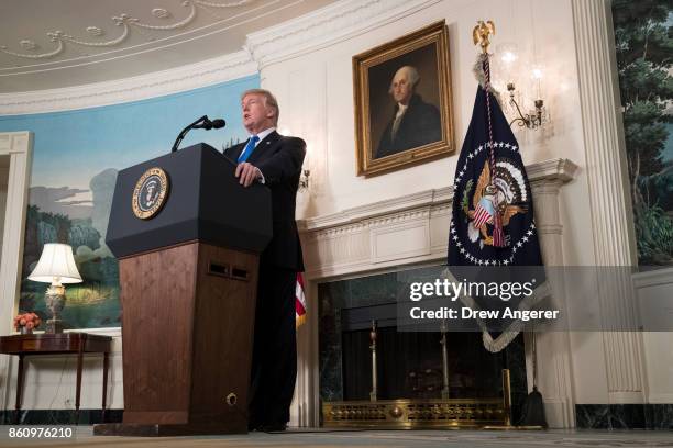 President Donald Trump makes a statement on the administration's strategy for dealing with Iran, in the Diplomatic Reception Room in the White House,...