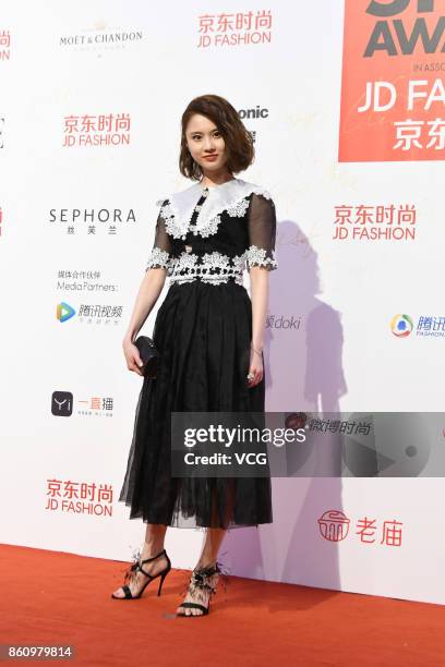 Actress Zhang Huiwen arrives at red carpet for the ELLE Style Awards at Shanghai Exhibition Center on October 13, 2017 in Shanghai, China.